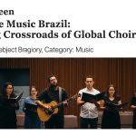 Choral concert in Brazil featuring a combined choir and orchestra under warm stage lighting.